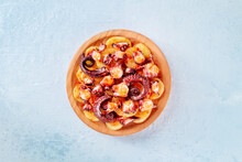 Pulpo A La Gallega, Spanish Octopus Snack, Galician Dish, Overhead Flat Lay Shot On A Slate Background