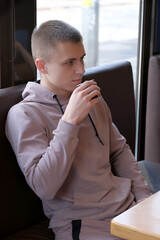 Young good-looking guy drinking coffee