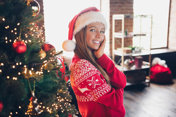 Wall Mural - Photo of shiny pretty little lady dressed red print pullover enjoying x-mas christmas spirit indoors home room