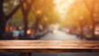 empty wooden table top for product display montages with blurred street view background