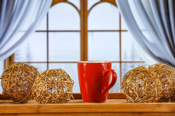 Wall Mural - Red mug of hot drink and winter christmas background of window sill. Empty space for your decoration. 