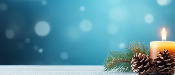  Christmas - Banner Of 1 candle and xmas ornament, Pine-cones And green Spruce Branches minimal blue background and lights in the back, with empty copy space