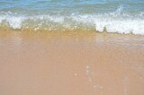 Fototapeta Morze - clear ocean waves on the beach