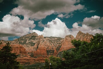 Canvas Print - Aerial view of rocky mountains surrounded by trees