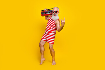 Poster - Full length photo of crazy brutal pensioner meloman holding hipsters boombox nostalgia at summer party isolated on yellow color background