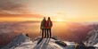 © Eli Berr - Couple man and woman hikers on top of a mountain with snow at sunset or sunrise, together enjoying their climbing success and the breathtaking view, looking towards the horizon