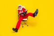 Photo of funky impressed retired guy wear red tux claus hat automobile driver rider isolated yellow color background
