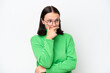 © luismolinero - Young caucasian woman isolated on white background having doubts and with confuse face expression