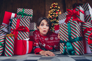 Poster - Photo of pretty young girl lying floor gift pile impressed wear trendy red sweater festive interior living room presents christmas tree