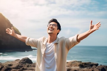 asian men stretch their arms enjoying vacation at the beach