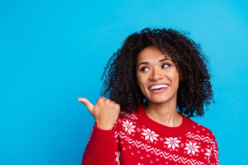 Wall Mural - Photo of funny youth girlfriend wearing red pullover indicating finger mockup happy new year greetings isolated on blue color background