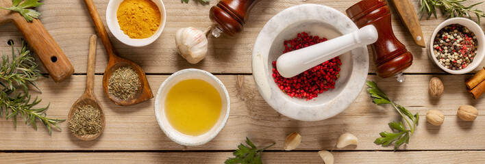 Poster - Asian menu concept. Healthy food cooking ingredients background with herbs, spices and olive oil on wooden table top view