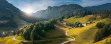 Country Road Green Hills Landscape With Curved Rural Road Blue Sky With Clouds Alpine Mountains