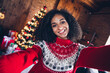 Photo of attractive positive lady toothy smile take selfie new year evergreen tree illumination flat indoors