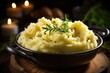 A close-up of fluffy mashed potatoes garnished with rosemary