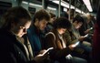 © piai - Train cabin during a rush hour full of people where everybody looking down on their highlighted cellphone screens