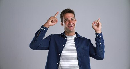 Poster - Studio man, happiness and pointing up at advertising promotion offer, direction or retail choice, discount or presentation. Commercial ads, mockup space and portrait person smile on grey background