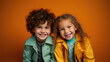© Julia Zarubina - cheerful children, boy and girl on a colored background in the studio, brother and sister, child, kid, toddler, childhood, portrait, face, emotional, expression, joy, friends, happiness, baby, clothes
