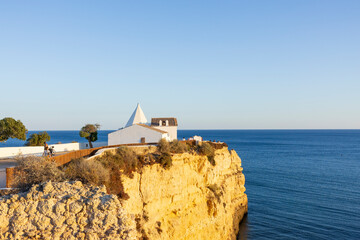 Wall Mural - View to the big cliff and the Chapel of Our Lady of the Rock (Igreja de Nossa Senhora da Rocha).  Porches, Algarve, Portugal