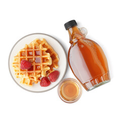 plate of tasty waffles with raspberries and maple syrup on white background