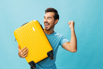 Man weekend vacation journey traveler flight guy yellow studio travel trip background happy suitcase baggage