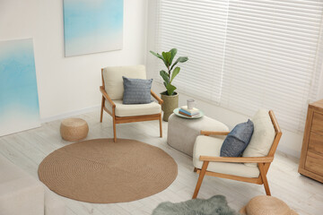 Wall Mural - Comfortable beige armchairs, ottoman and houseplant in living room, above view. Interior design