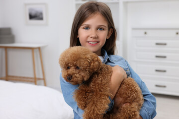 Canvas Print - Little child with cute puppy at home. Lovely pet