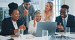 © Azeemud/peopleimages.com - Laptop, business people and group celebrate, applause and cheers for project, revenue or achievement. Online statistics, data analytics and team clapping for success results, feedback report or news