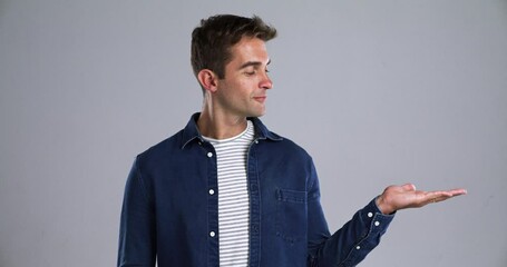 Poster - Studio man, smile and palm gesture for advertising promotion offer, sales deal or show retail choice, discount or services. Commercial information, mockup space and portrait person on grey background