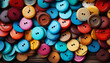 © Vagengeim - Colorful wooden buttons with two and four holes scattered on a table