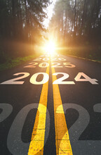 Vertical, 2024 New Year Road Trip Travel And Future Vision Concept . Nature Landscape With Highway Road Leading Forward To Happy New Year Celebration In The Beginning Of 2024 For Fresh 