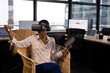 © Wavebreak Media - African american casual businesswoman in vr headset using tablet and virtual interface in office