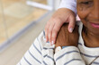 © Wavebreak Media - Caucasian female nurse's hand on senior african american woman's shoulder