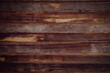 Background of horizontal old dark wooden planks. Weathered wooden structure.