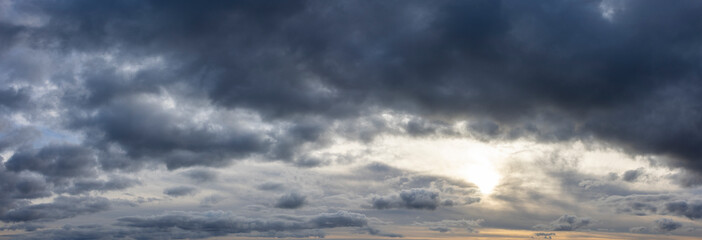 Wall Mural - panoramic cloudscape with dark moody atmospheric clouds