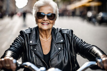 Happy Beautiful Elderly Senior Woman With Grey Hair Rides A Motorcycle Along A City Street, Laughing And Smiling, Mature Old Biker In Black Leather Jacket
