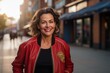Portrait of a happy woman in her 50s sporting a stylish varsity jacket against a busy urban street. AI Generation