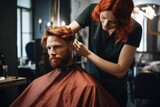 Stylish fashionable man with red hair and beard in a barbershop . Professional stylist woman barber, barber does styling for his client in a modern salon. 