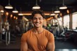 Portrait of a grinning man in his 20s donning a trendy cropped top against a dynamic fitness gym background. AI Generation