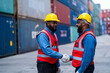 © KANGWANS - African engineers Supervising loading containers from cargo ships. logistics yard business Import and Export Freight Forwarding Industry