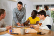 © JackF - Group of active men play board games during a friendly meeting