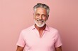 Portrait of a smiling man in his 60s donning a trendy cropped top against a pastel or soft colors background. AI Generation