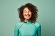 Portrait of a grinning woman in her 20s showing off a vibrant rash guard against a pastel or soft colors background. AI Generation