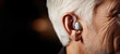Hearing aids for seniors, aid, technology, or healthcare or medical device consultation for deaf patients with tinnitus. Listening, testing, and exam ear tech with a senior male in the clinic