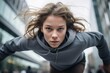 © Markus Schröder - active kid female doing parkour in the city