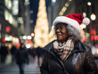 © kalafoto - business people wearing a Santa hat walks down the street on Christmas night