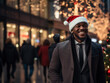 © kalafoto - business people wearing a Santa hat walks down the street on Christmas night
