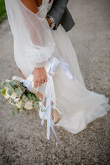 Wall Mural - Bride and groom. Just married. Happy couple walking away.