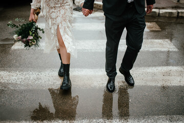 Wall Mural - Bride and groom. Just married. Happy couple walking away.