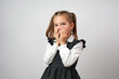 © Gecko Studio - Portrait of cute kid girl with hands on face, white background